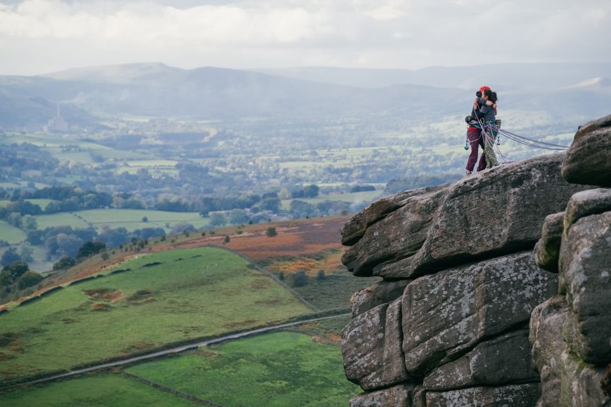Climbers on a gritstone edge in the Peak District